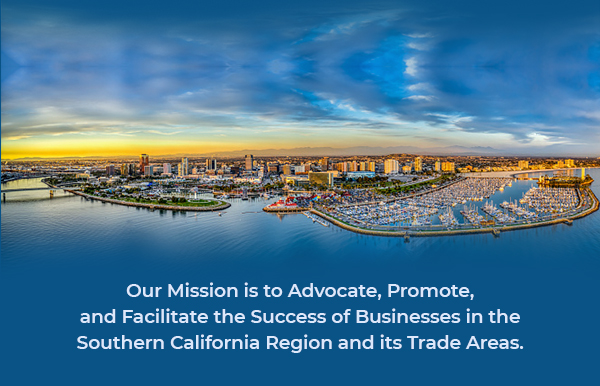 A panoramic view of a marina with boats under a vibrant sky at sunset.